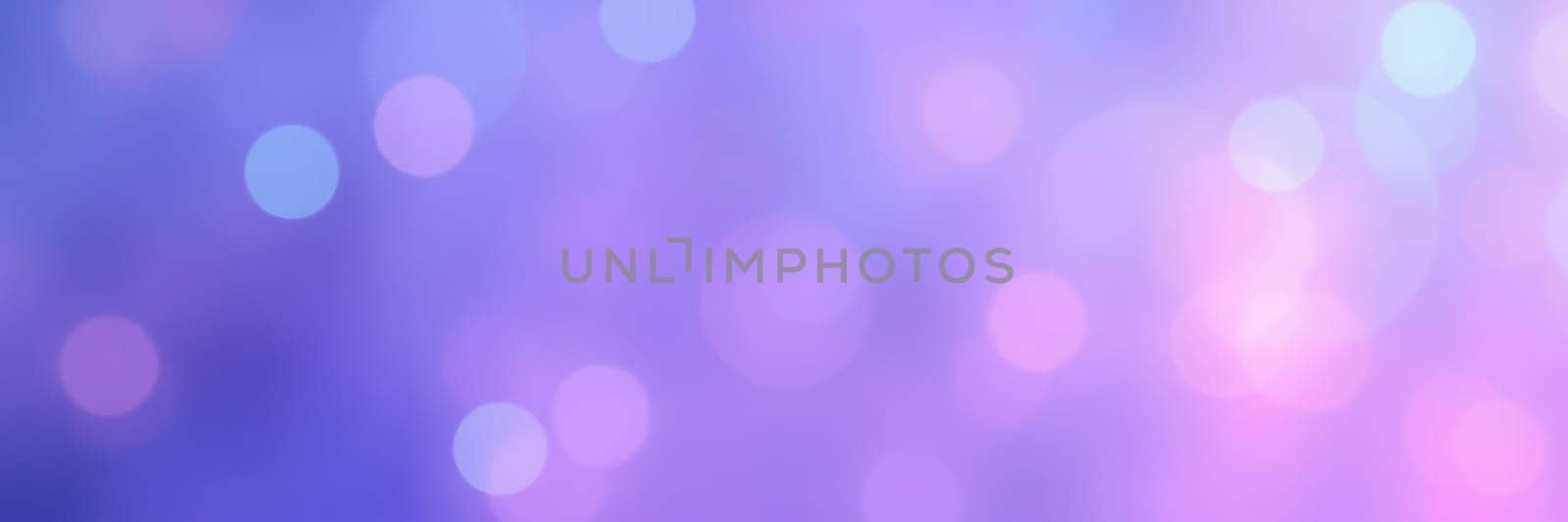 A beautiful array of soft pastel bokeh lights in purple and pink hues fills the background, adding a dreamy quality ideal for creative designs and artistic projects.