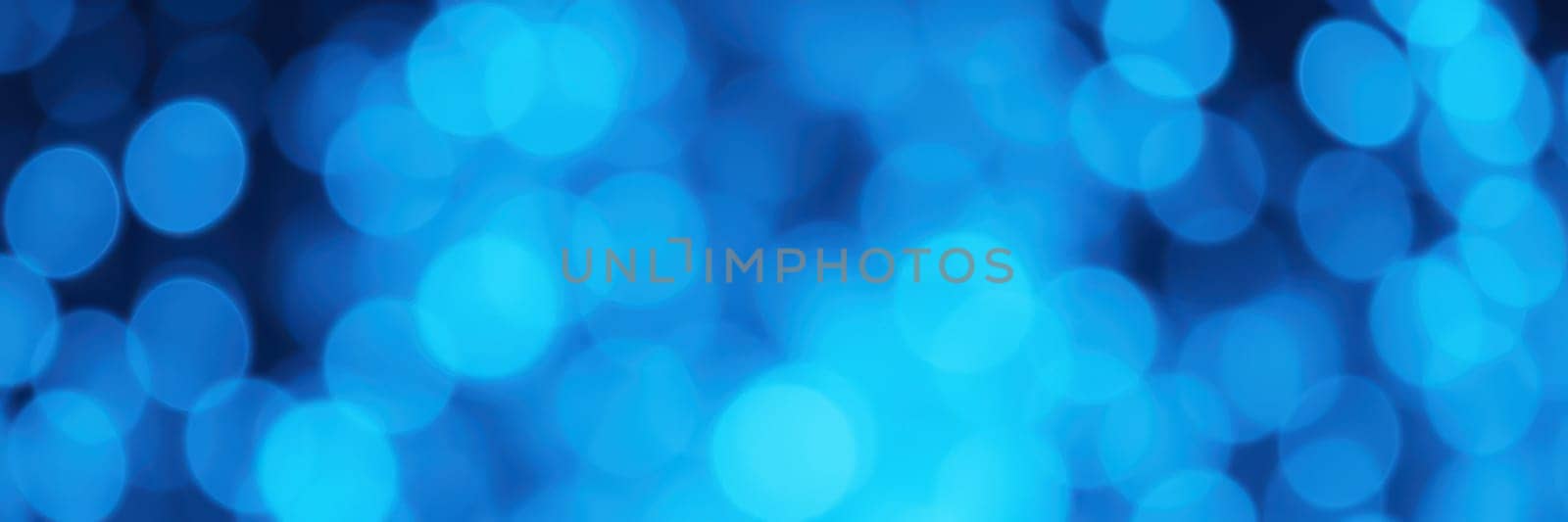 Soft glowing blue lights create a dynamic abstract background. The design evokes a sense of calm and tranquility, perfect for various creative projects.