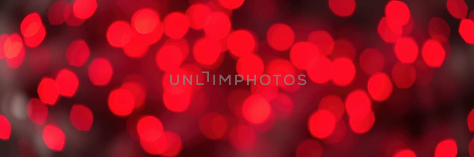 A collection of bright red bokeh lights fills the background, creating a lively and joyful ambiance that enhances the festive mood during nighttime festivities.