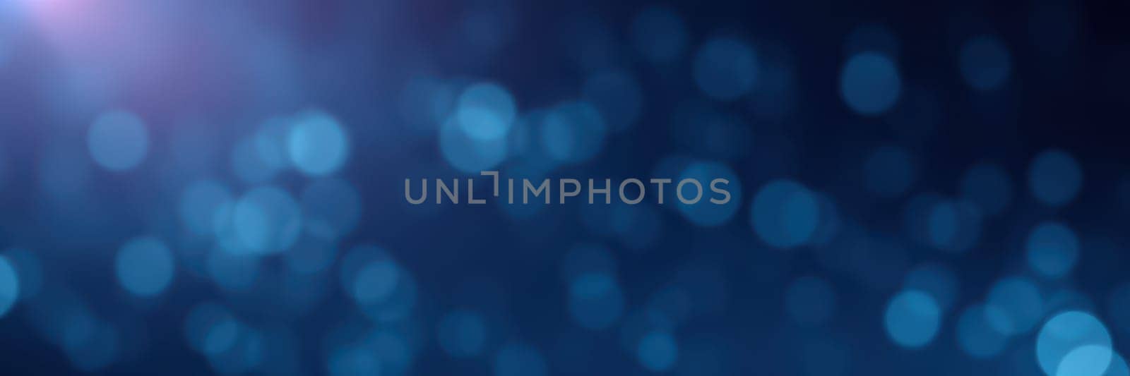 Gentle blue bokeh lights fill the background, creating a tranquil ambiance ideal for relaxation or evening gatherings. The soft glow enhances the mood and invites serenity.