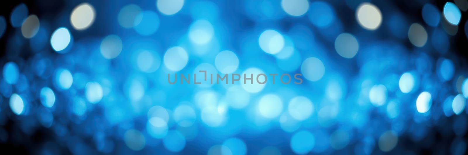 Soft blue bokeh lights shimmer in the background, offering a beautiful and festive atmosphere suitable for parties or special occasions. The lights create a magical and inviting environment.