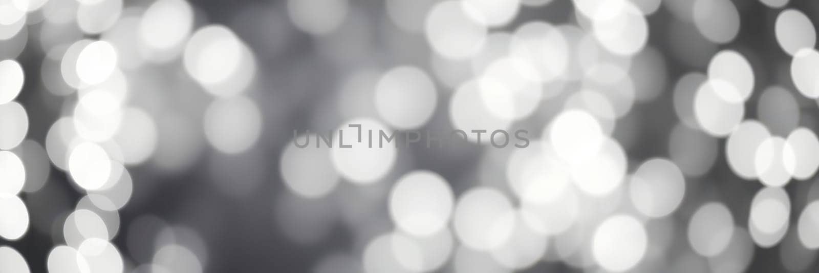 Soft, blurred lights in a monochromatic palette create a captivating bokeh effect, perfect for enhancing the ambiance of any event or design project.
