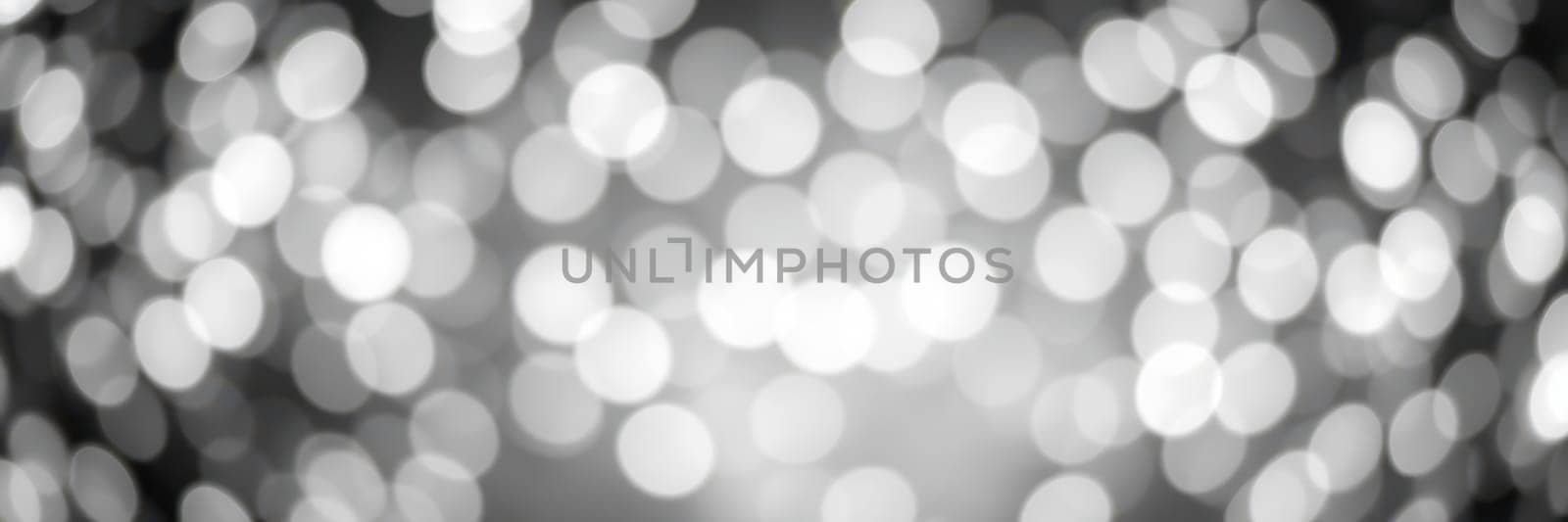 A beautiful array of bright, blurred lights fills the space, creating a magical and festive atmosphere for a celebration. The bokeh effect adds depth and warmth to the scene.