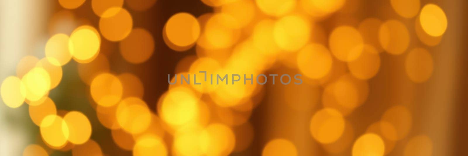 Soft, glowing bokeh lights fill the background, creating a warm, inviting ambiance suited for an evening celebration. The golden hues enhance the festive spirit.
