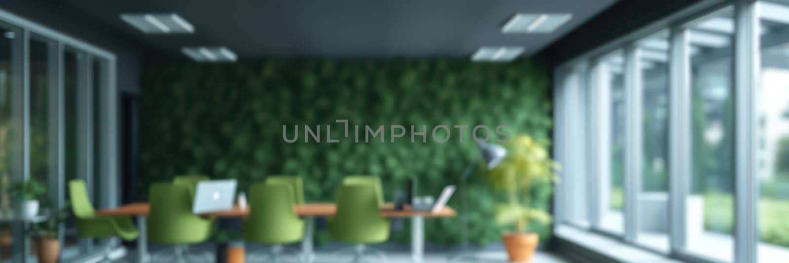 Bright and inviting office environment featuring green plants, a meeting table surrounded by chairs, and large windows allowing natural light to flood in.