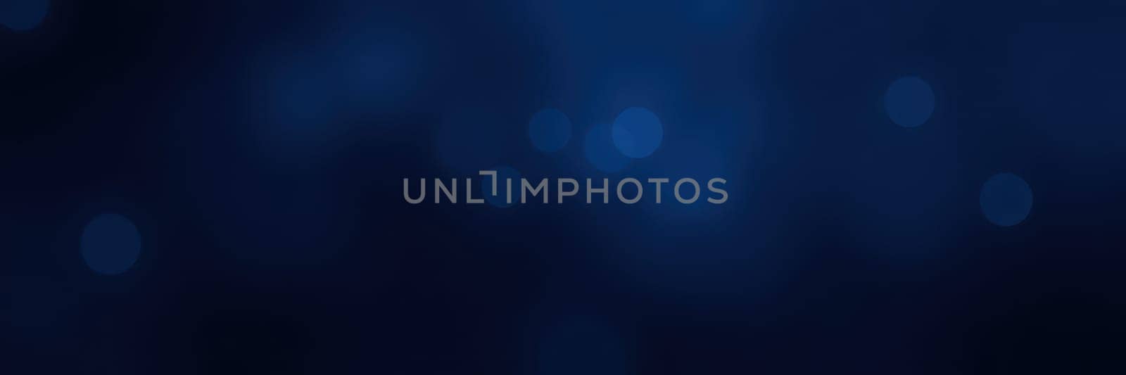A group of divers explores an underwater world, surrounded by dynamic patterns of light reflecting off bubbles in a serene blue environment.