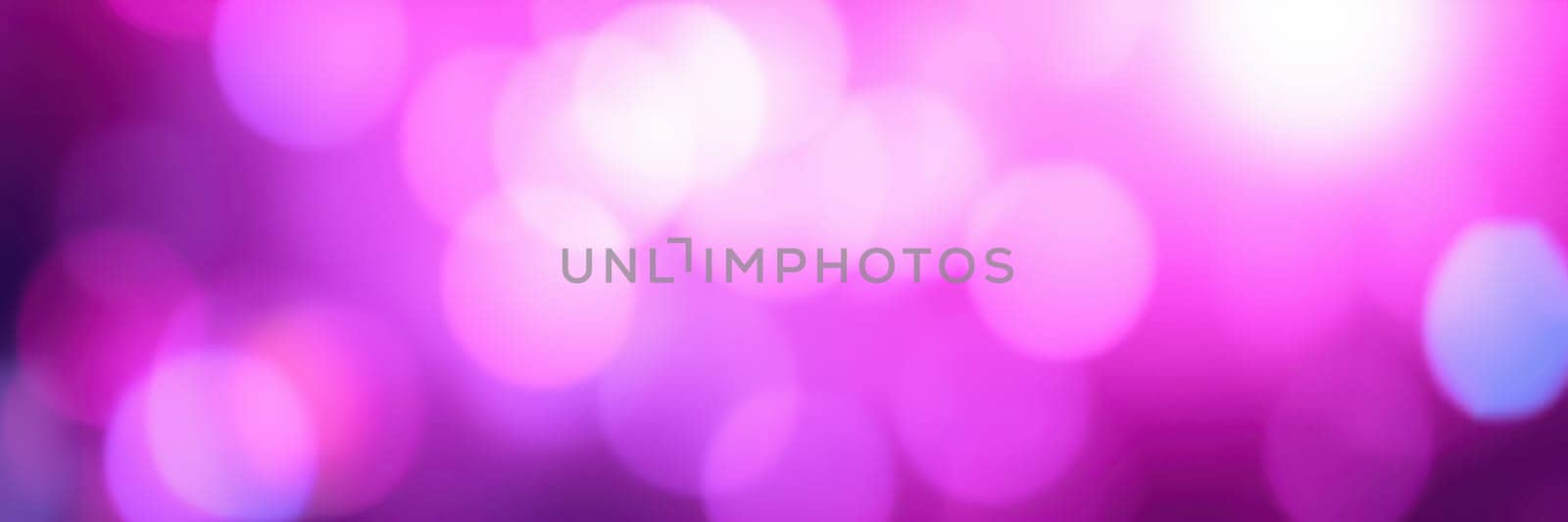 A mesmerizing display of pink and purple bokeh lights fills the atmosphere, enhancing the festive mood of an indoor celebration. Soft glows radiate warmth and excitement.