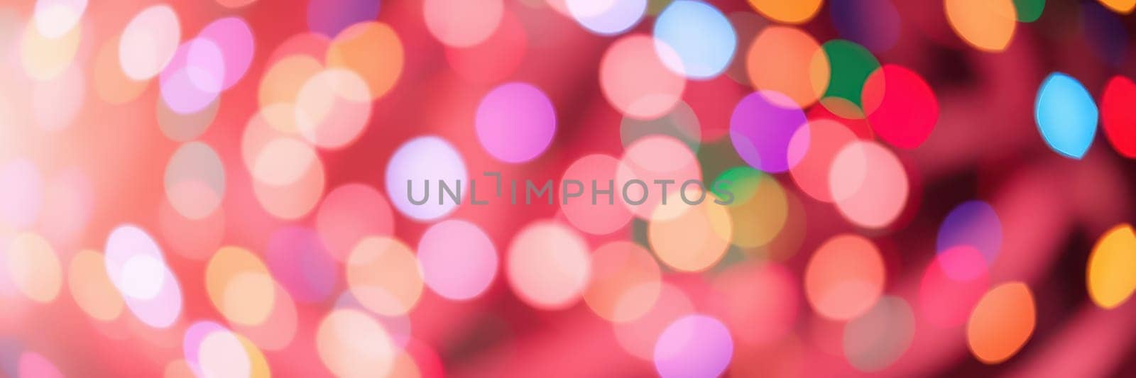 A multitude of vibrant, colorful bokeh lights illuminates an urban scene, enhancing the festive spirit during a night-time celebration. The lights create a joyful ambiance.