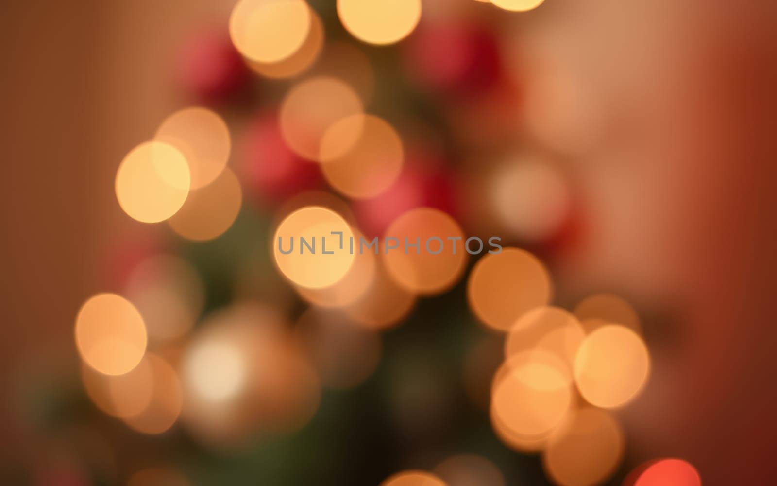 A beautifully decorated Christmas tree is adorned with twinkling lights and colorful ornaments, creating a warm and festive atmosphere during the holiday season.