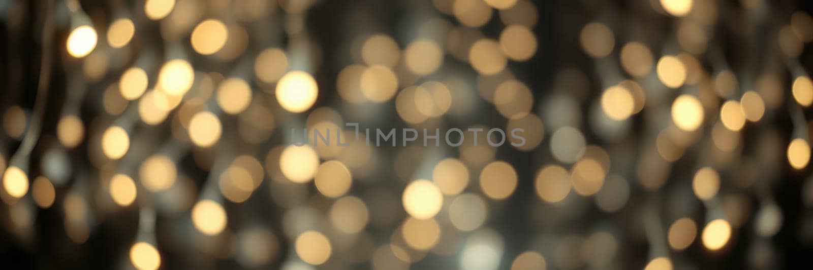 Twinkling golden lights illuminate a warm indoor setting, creating a cozy atmosphere perfect for gatherings. The soft glow enhances the inviting feel of the space.