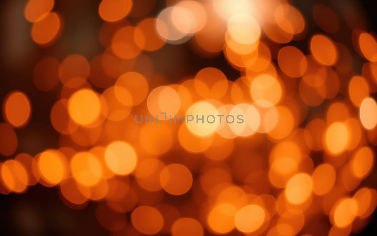 Soft, blurred orange lights illuminate the area, casting a warm glow. The ambient setting suggests a relaxed mood, perfect for gatherings in a cozy indoor environment.