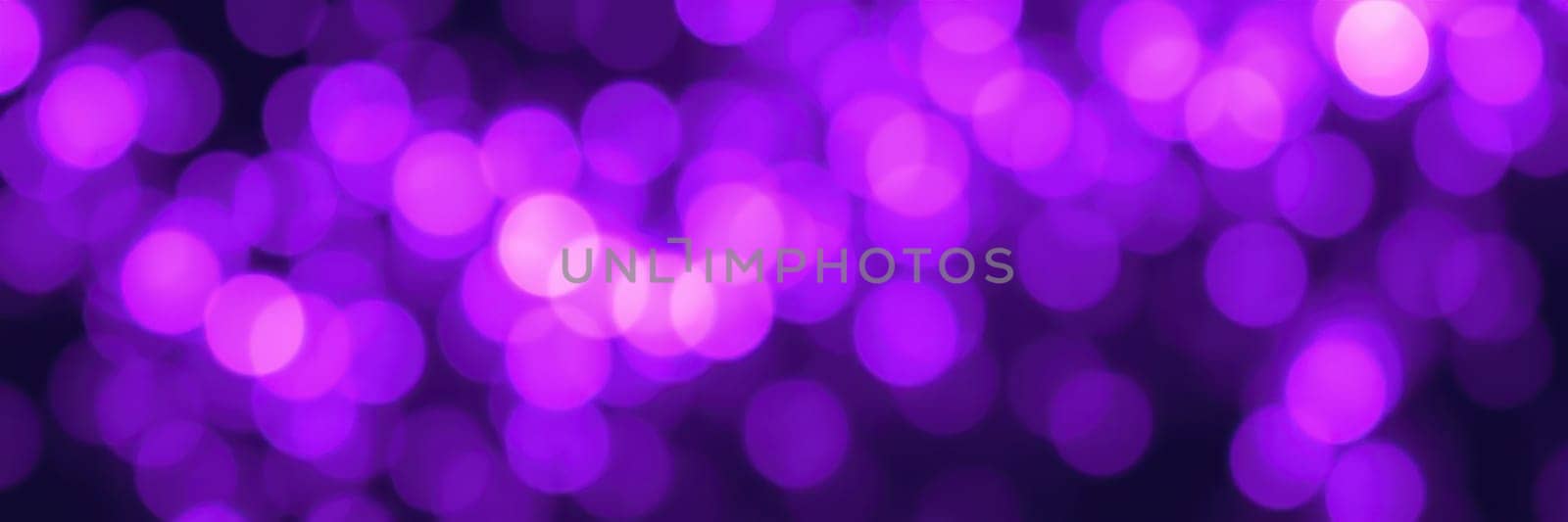 Bright purple lights form a captivating bokeh effect, enhancing the ambiance of nightlife. This enchanting display of colors sets a joyful mood for gatherings and festivities.