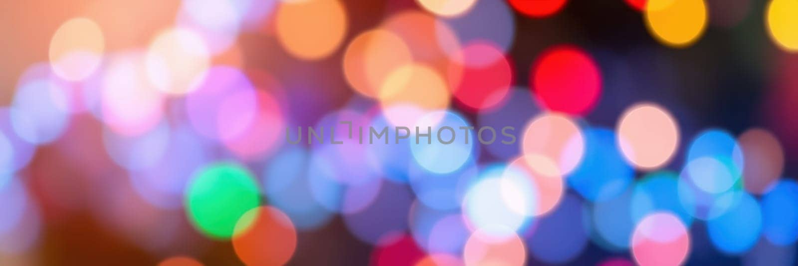 A dazzling display of multicolored lights fills the air with energy and excitement during a lively evening event, capturing the joyful spirit of celebration.