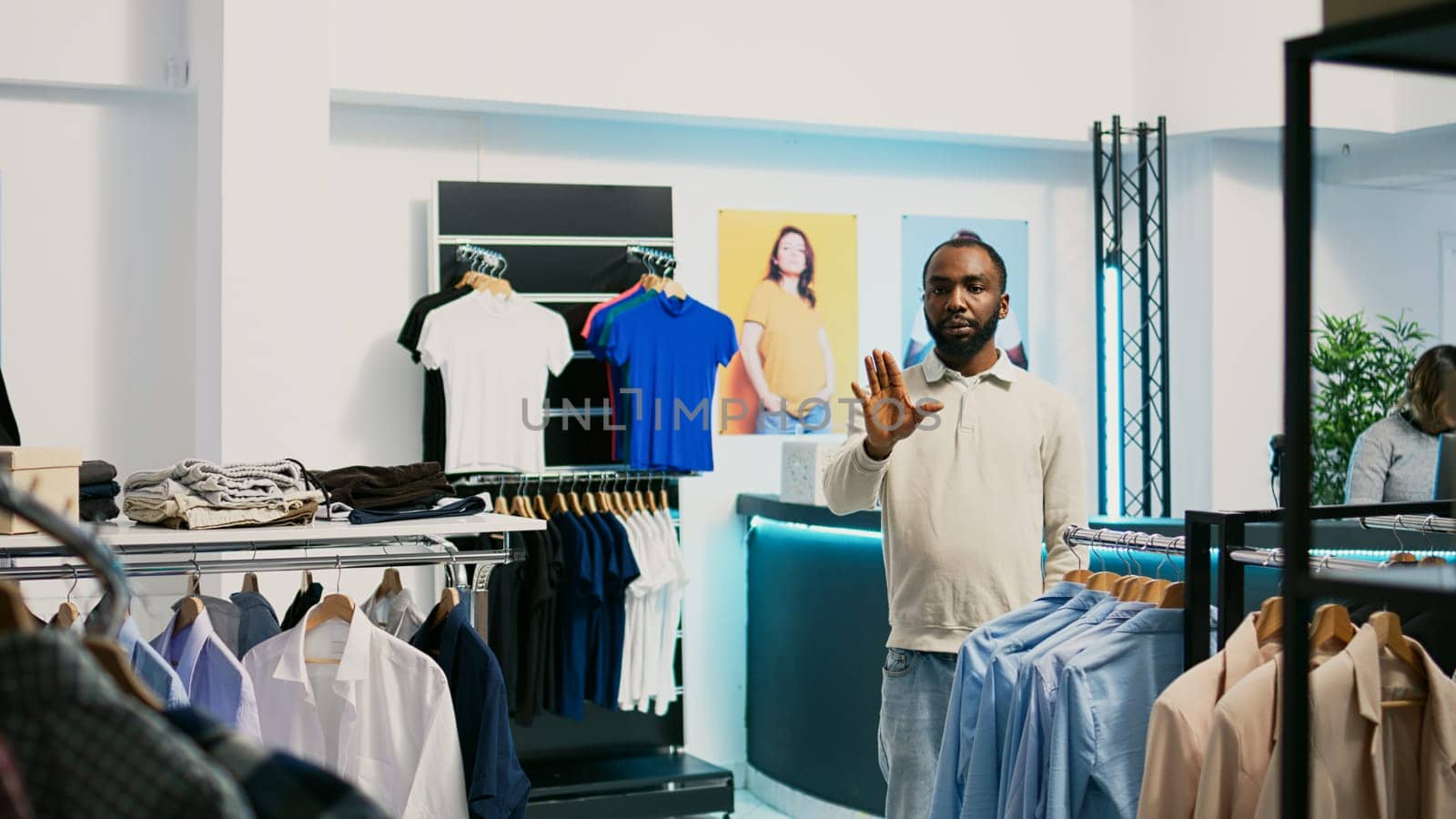 African american shopper using hologram in boutique by DCStudio