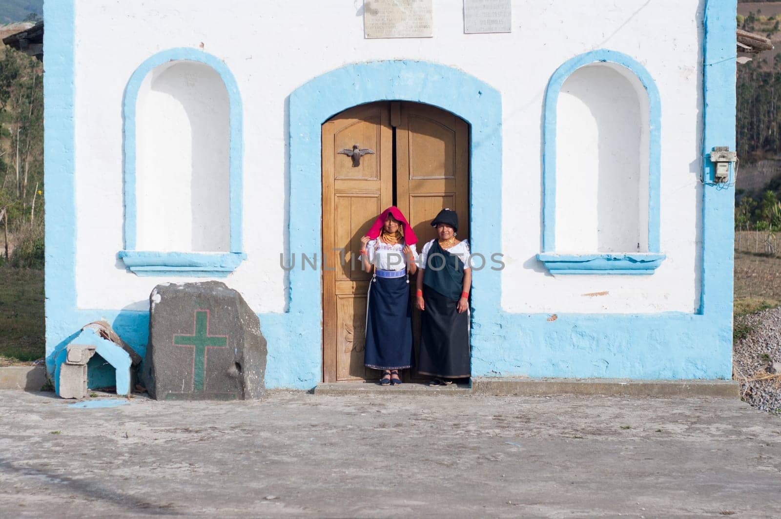 Mom and Daughter Leaving a Cute Little Church After Dia de los Muertos Prayers by Raulmartin