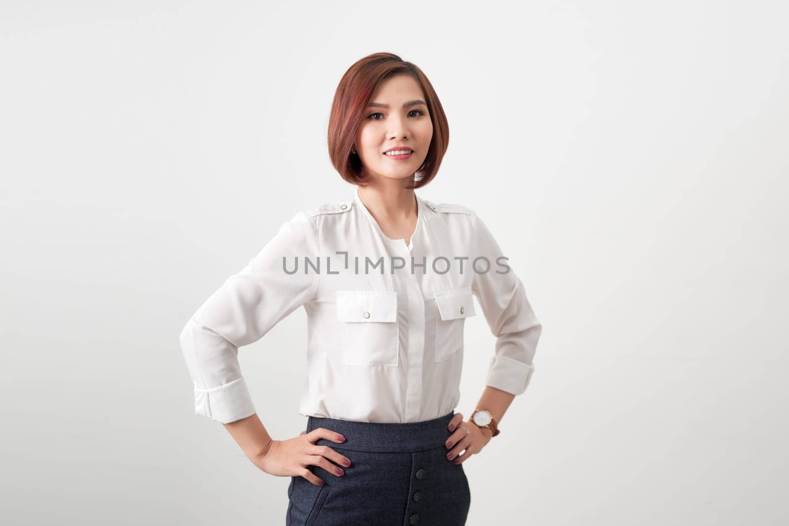 An attractive young woman with toothy smile wearing blazer isolated on white banner background