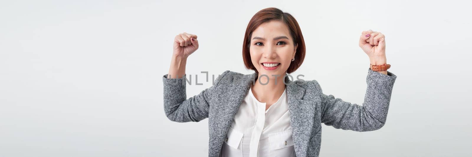 Successful business woman with arms up - isolated over a white background. banner