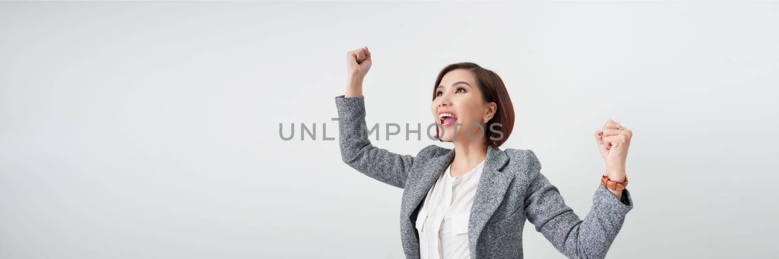 Successful woman with arms up celebrating on white banner by makidotvn