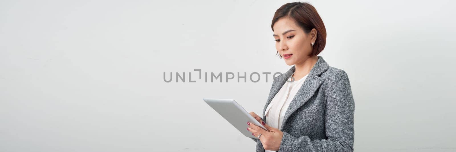 Banner of happy pretty woman standing isolated on white background, holding clipboard by makidotvn