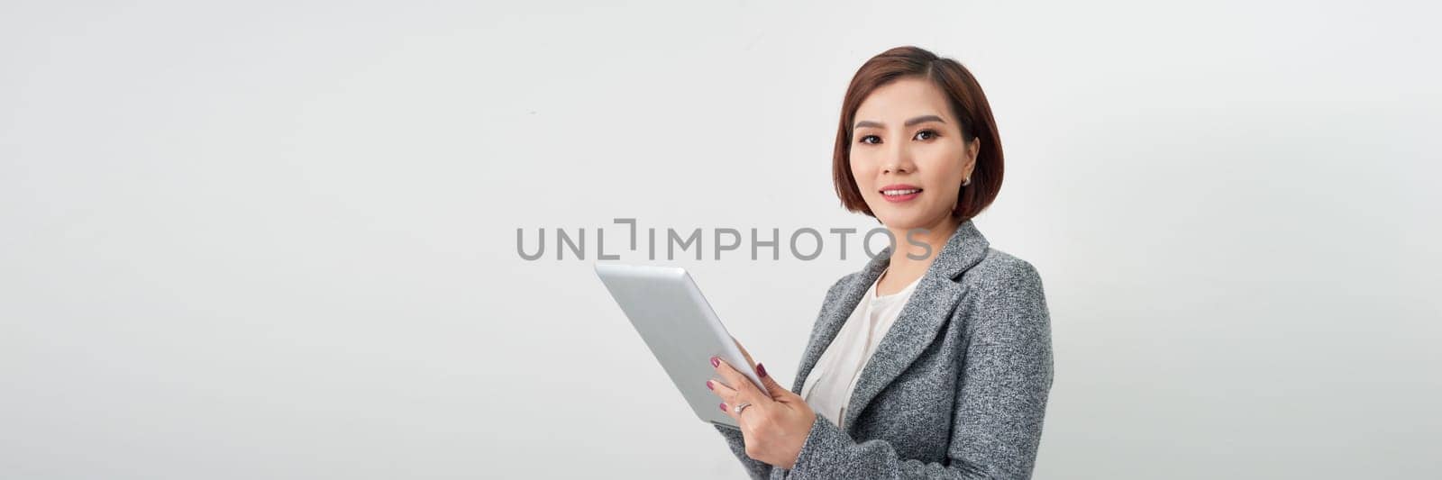 Banner of happy pretty woman standing isolated on white background, holding clipboard
