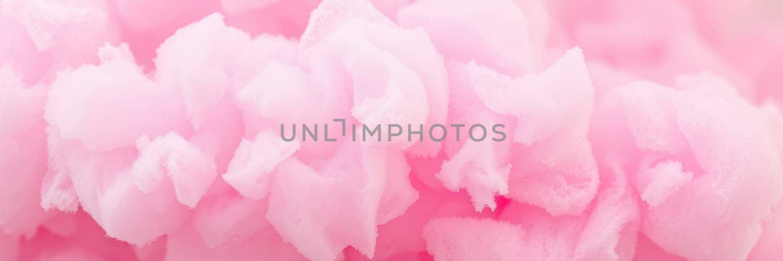 Colorful cotton candy stands are featured at a lively summer fair, drawing families and children eager to enjoy the sugary delight under the evening sun.