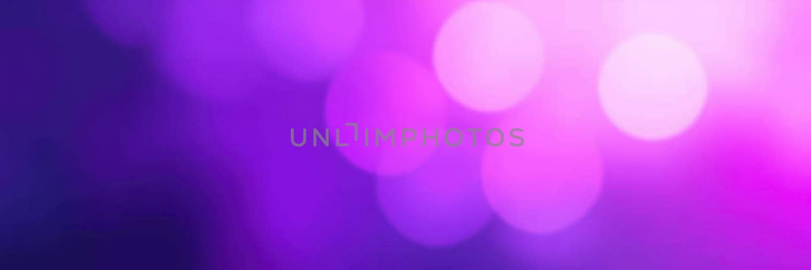 Glowing purple lights softly illuminate the area, creating a magical ambiance for guests enjoying an evening event at a local venue, enhancing the festive atmosphere.