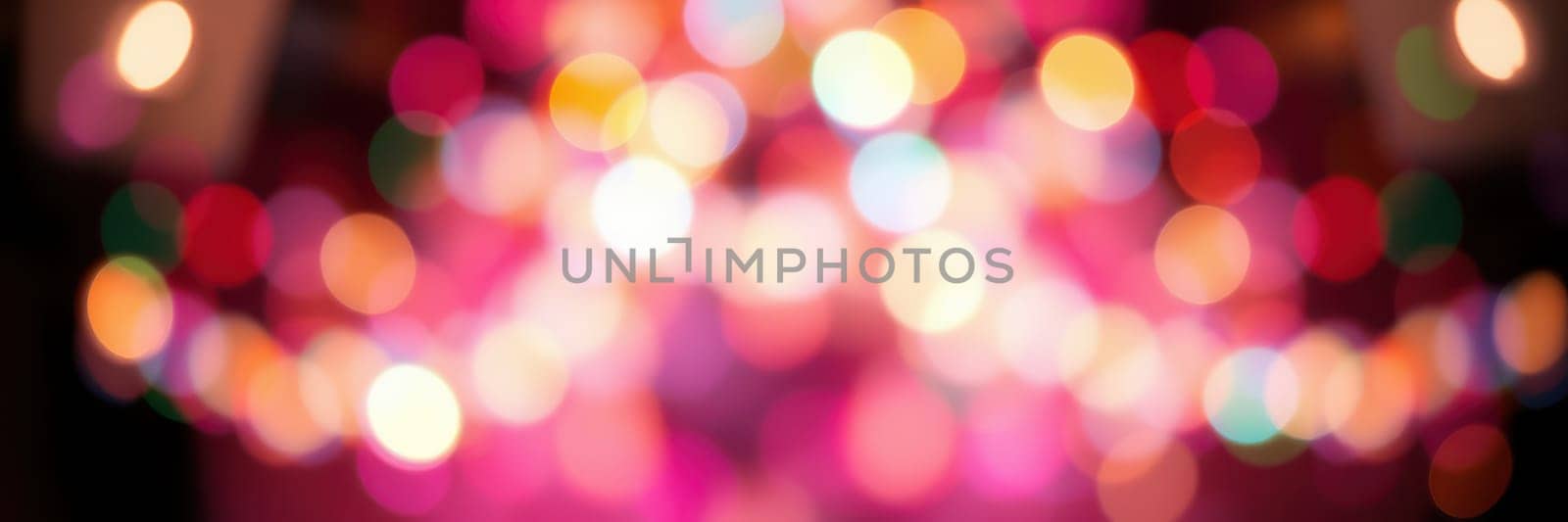 Vibrant bokeh lights fill the background, creating an exciting and festive atmosphere during a celebration. The mixture of colors enhances the joyful mood of the event.