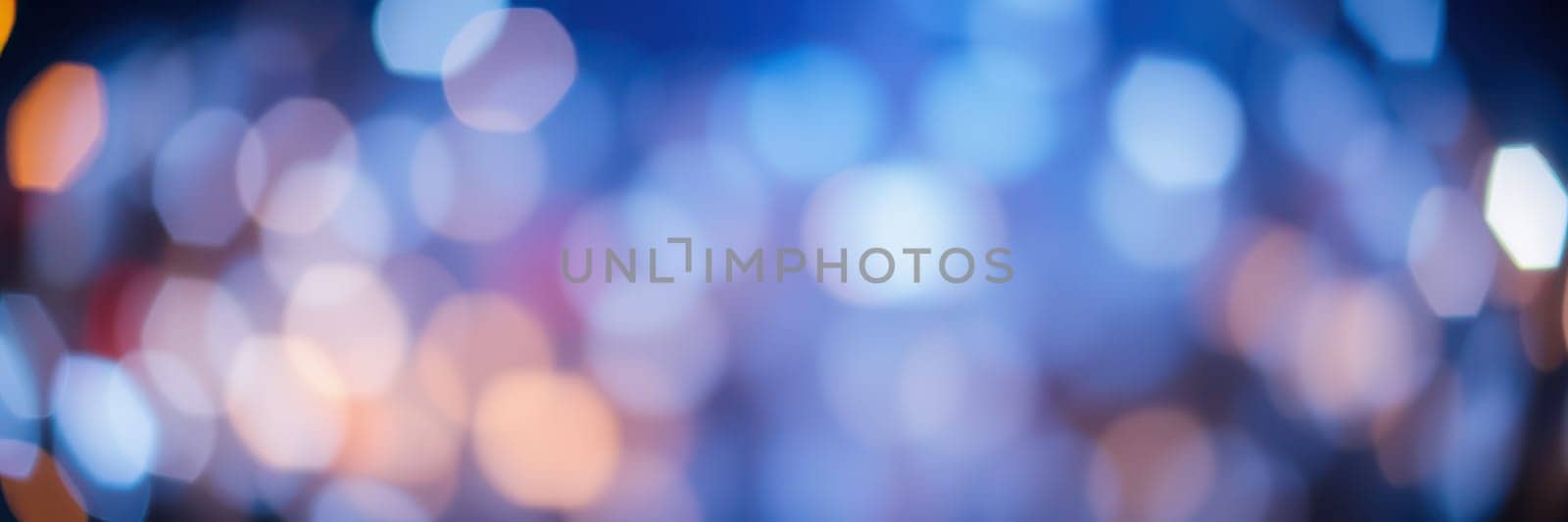 Vibrant bokeh lights illuminate the backdrop of an evening gathering, adding a magical touch to the festive atmosphere as people mingle under the colorful glow.