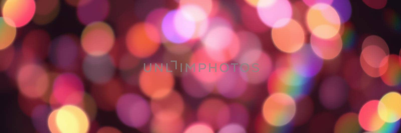 Bright and vivid bokeh lights fill the scene, creating a festive ambiance during a nighttime event in the city. The colors blend beautifully, enhancing the celebratory mood.