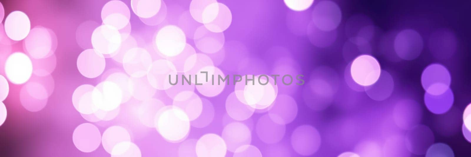 A mesmerizing display of purple and pink bokeh lights creates a dynamic and colorful background, perfect for enhancing events, celebrations, or artistic projects during evening gatherings.