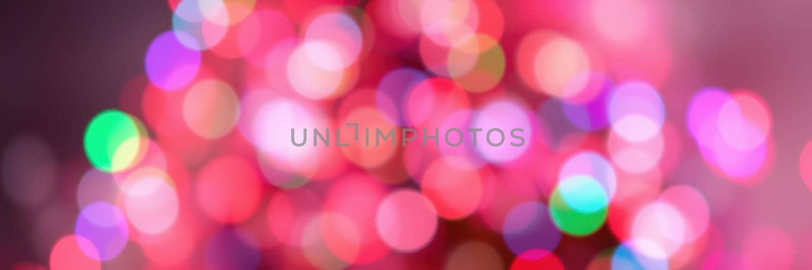 Bright and colorful lights fill the background, creating a vibrant and festive atmosphere perfect for a night celebration. The soft bokeh effect adds depth and charm.