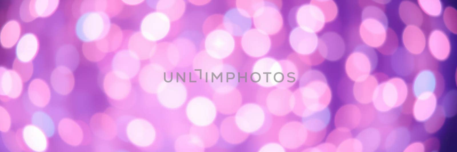 Soft, colorful bokeh lights fill the background, creating a magical ambiance for a lively event in an indoor environment. Guests enjoy the festive atmosphere and celebrate together.