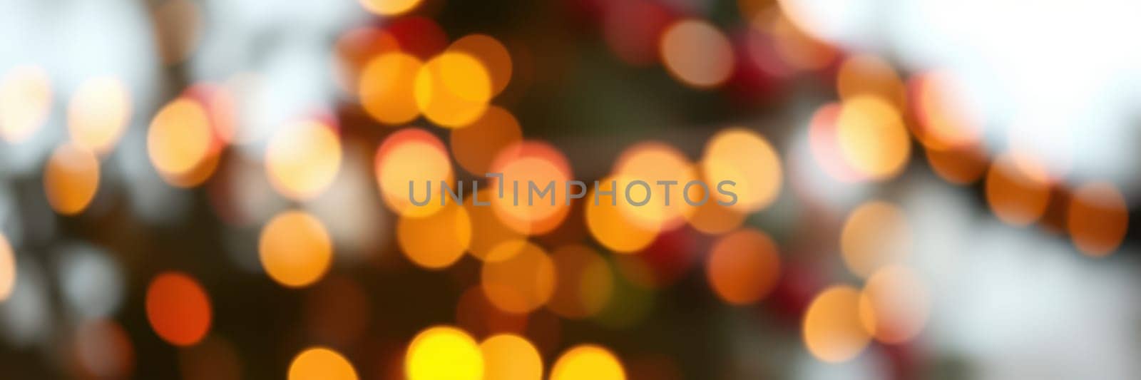 Twinkling holiday lights softly illuminate the background, creating a warm, inviting ambiance perfect for celebrations during the winter season.