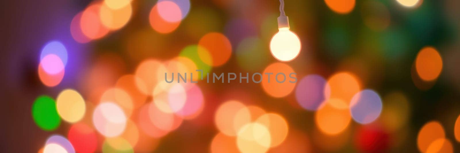 Bright, multicolored lights create a warm and cheerful ambiance, enhancing the festive spirit during holiday gatherings at home. The soft glow promotes joy and togetherness.