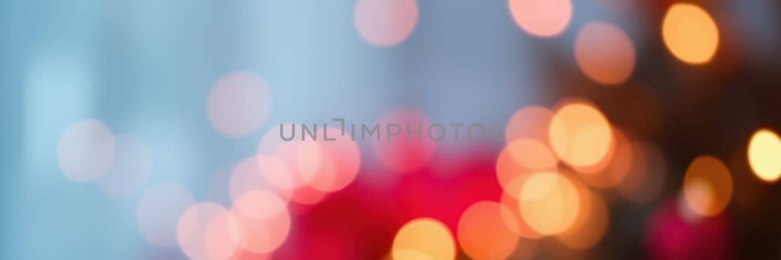 Soft, colorful bokeh lights fill the background, enhancing the warm and inviting atmosphere of a joyful celebration taking place in the evening, surrounded by loved ones.