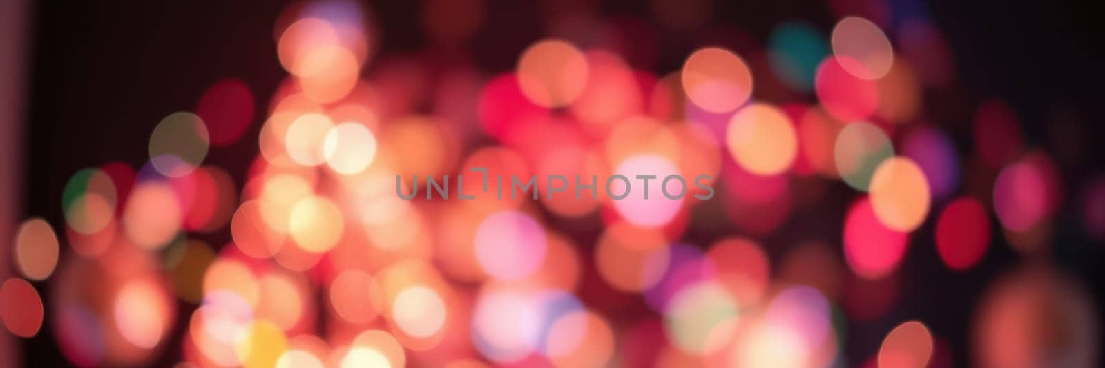 Colorful lights blur together, creating a warm and inviting ambiance for a nighttime celebration in a city. The atmosphere is filled with joy and excitement.
