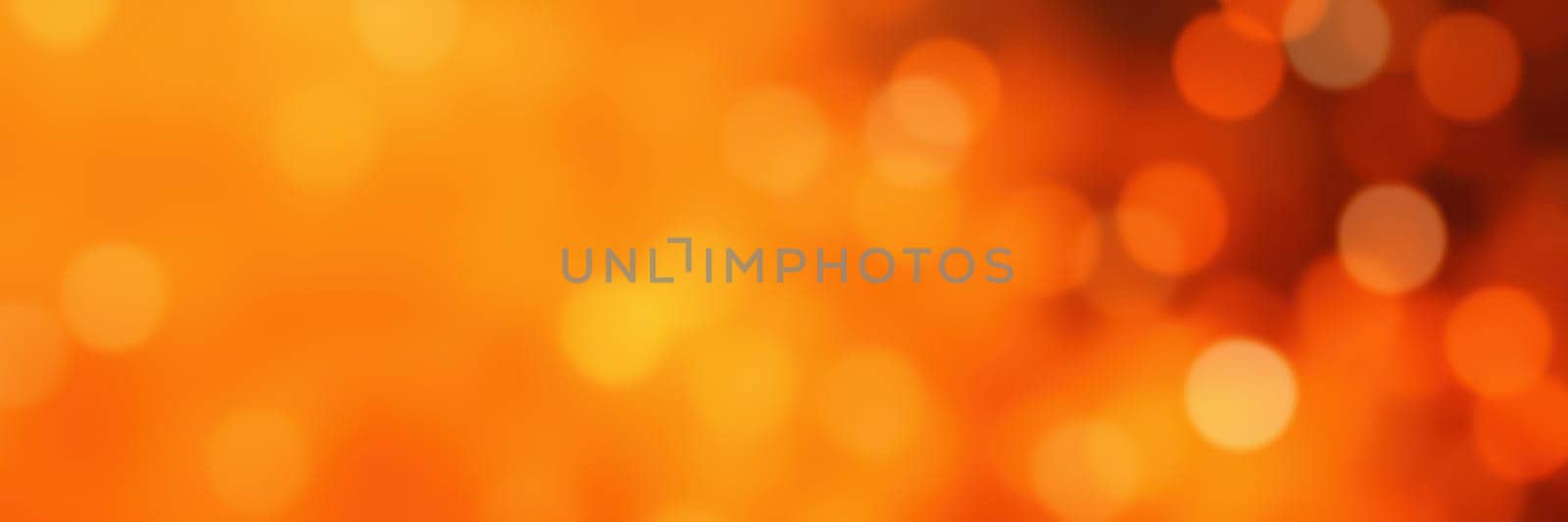 A warm display of blurred orange bokeh lights fills the background, offering a cozy ambiance ideal for autumn gatherings and celebrations in the evening.