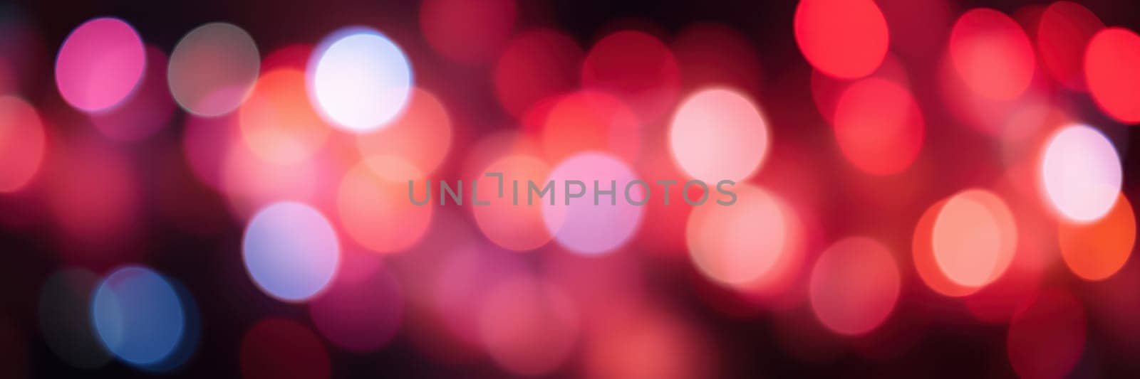 Vivid, multicolored lights blend together in a blurred display, capturing the lively spirit of a nighttime event filled with joy and excitement.