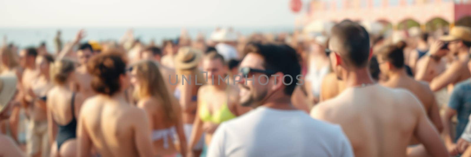 A vibrant beach party unfolds as a large group of people enjoys music and socializing under the sun. The atmosphere is filled with laughter and energy, creating a sense of community.