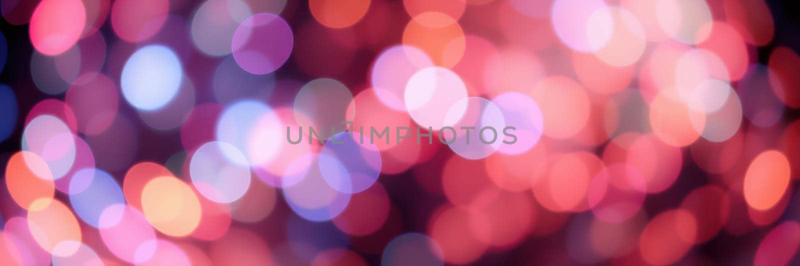A mesmerizing display of colorful bokeh lights illuminates the night, enhancing the festive atmosphere and creating a lively ambiance in a bustling urban setting.