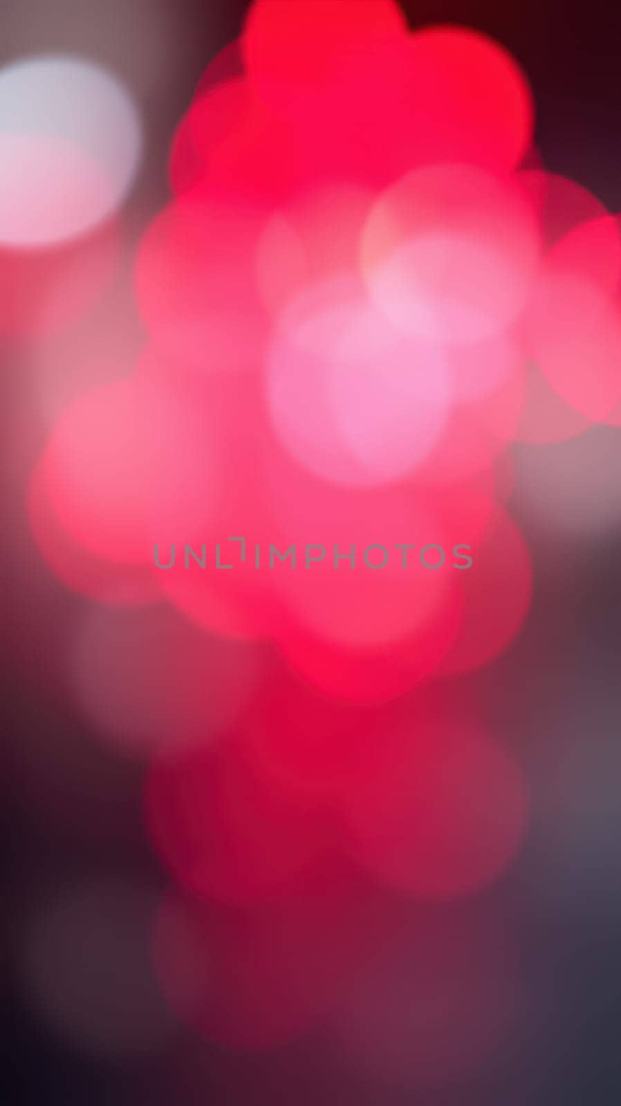 Rich red bokeh lights fill the space, evoking a warm, festive feeling. The soft glow enhances the nightlife ambiance as it blurs into the background, perfect for celebrations.