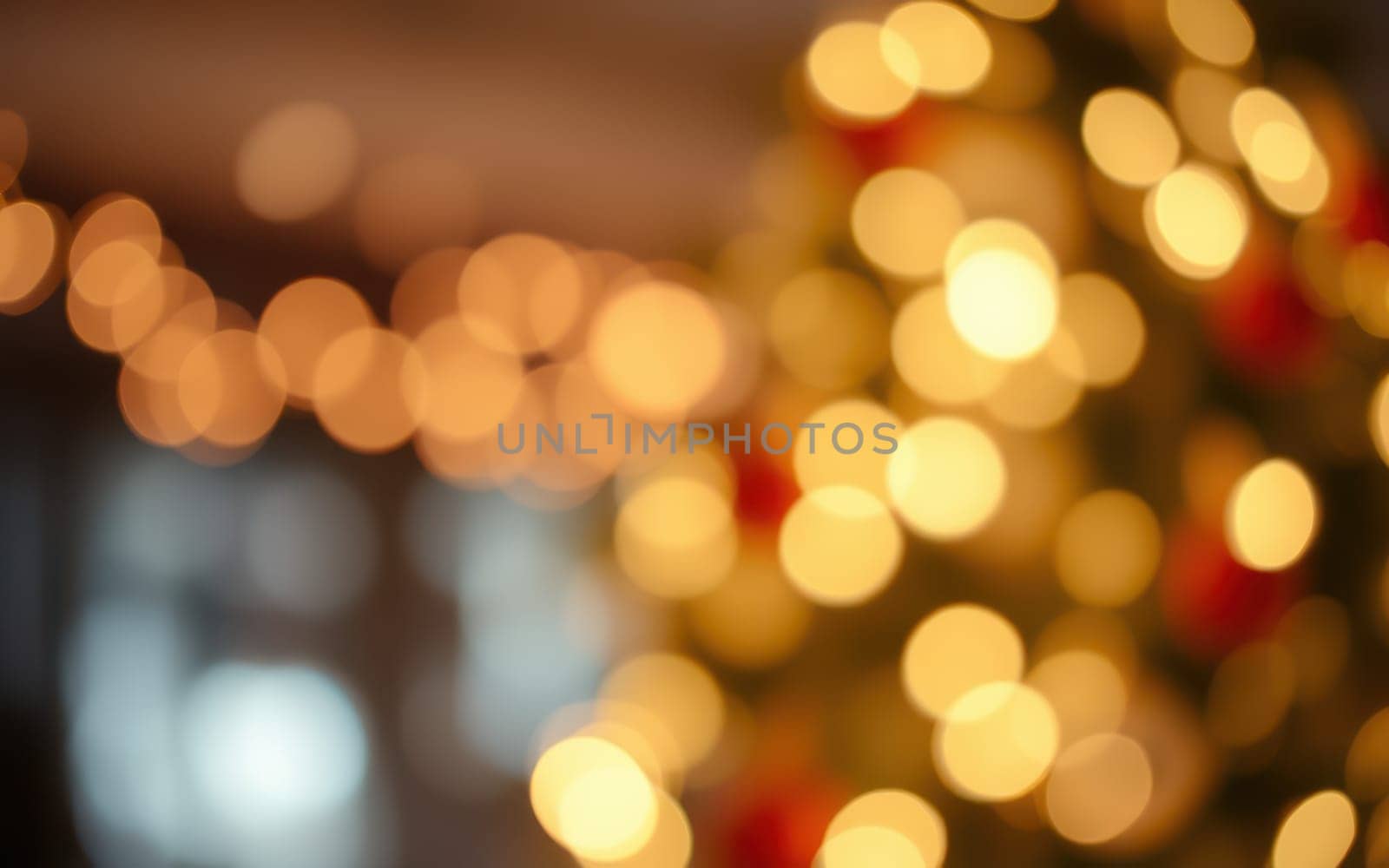 Bright, soft lights shimmer in golden hues, adding a cozy feel to the holiday atmosphere. The background hints at a decorated space filled with seasonal joy.