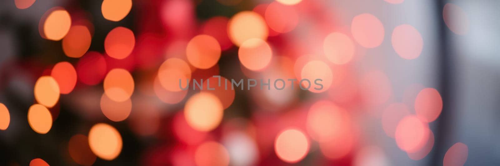 Softly blurred, colorful lights twinkle in a cozy indoor environment, enhancing the festive atmosphere during a holiday celebration in December.