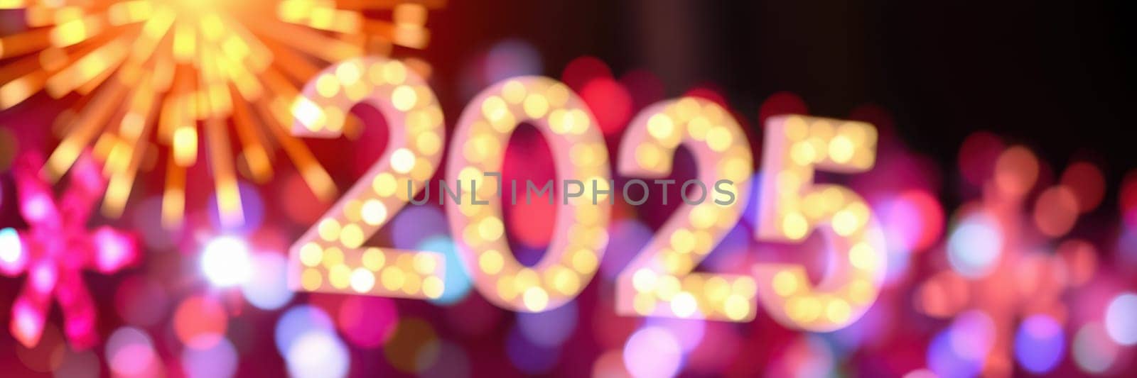 Vibrant lights and decorations create a festive ambiance as people prepare for the celebration of the upcoming year 2025, filled with excitement and joy.