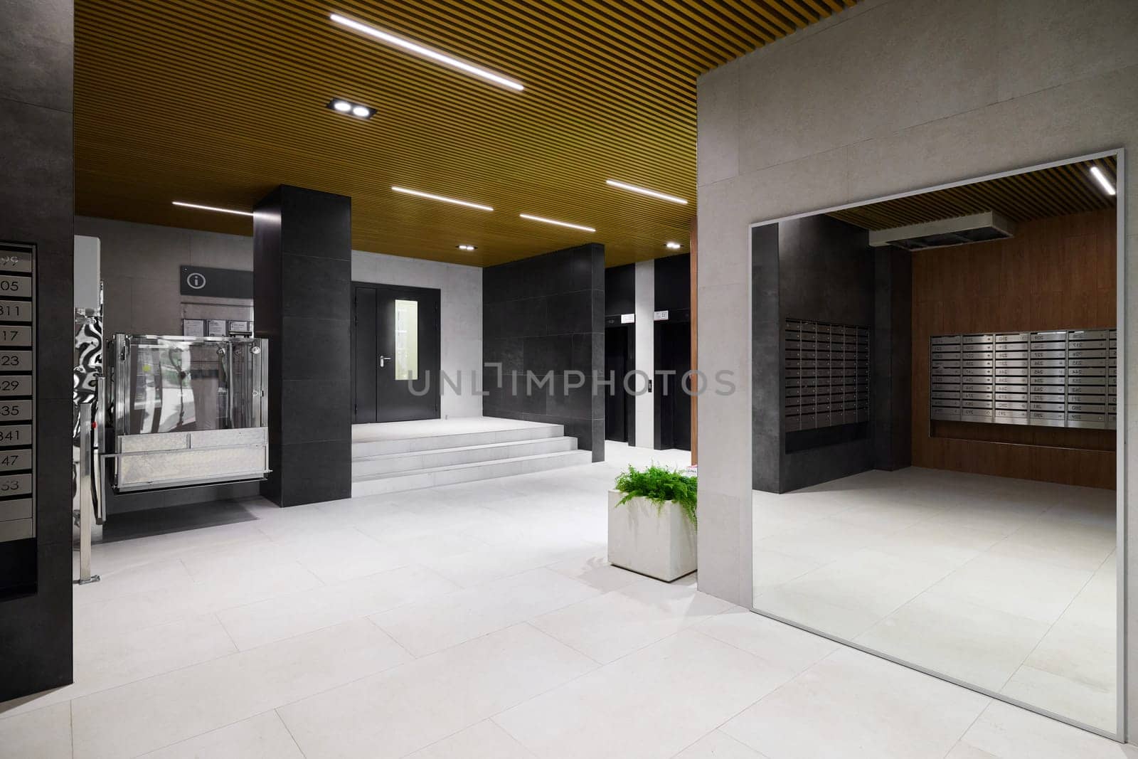 A stylish and minimalistic lobby featuring sleek lines and contemporary decor that creates an inviting atmosphere