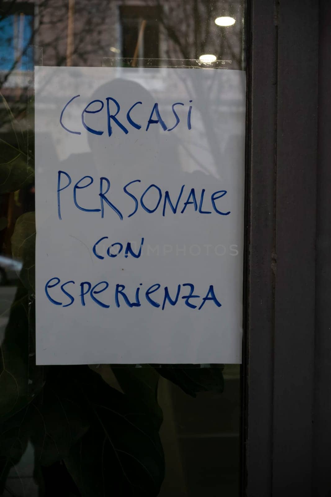 Cremona, Italy - November 27th 2024 Sign seeking experienced personnel displayed on a shop window in cremona, italy, reflecting current job market trends