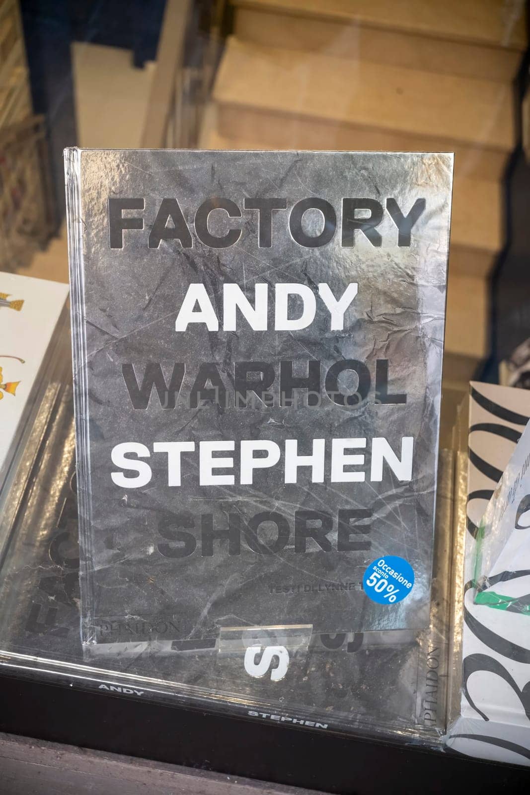 Cremona, Italy - November 27th 2024 Book about andy warhol's factory by stephen shore displayed in a bookstore window