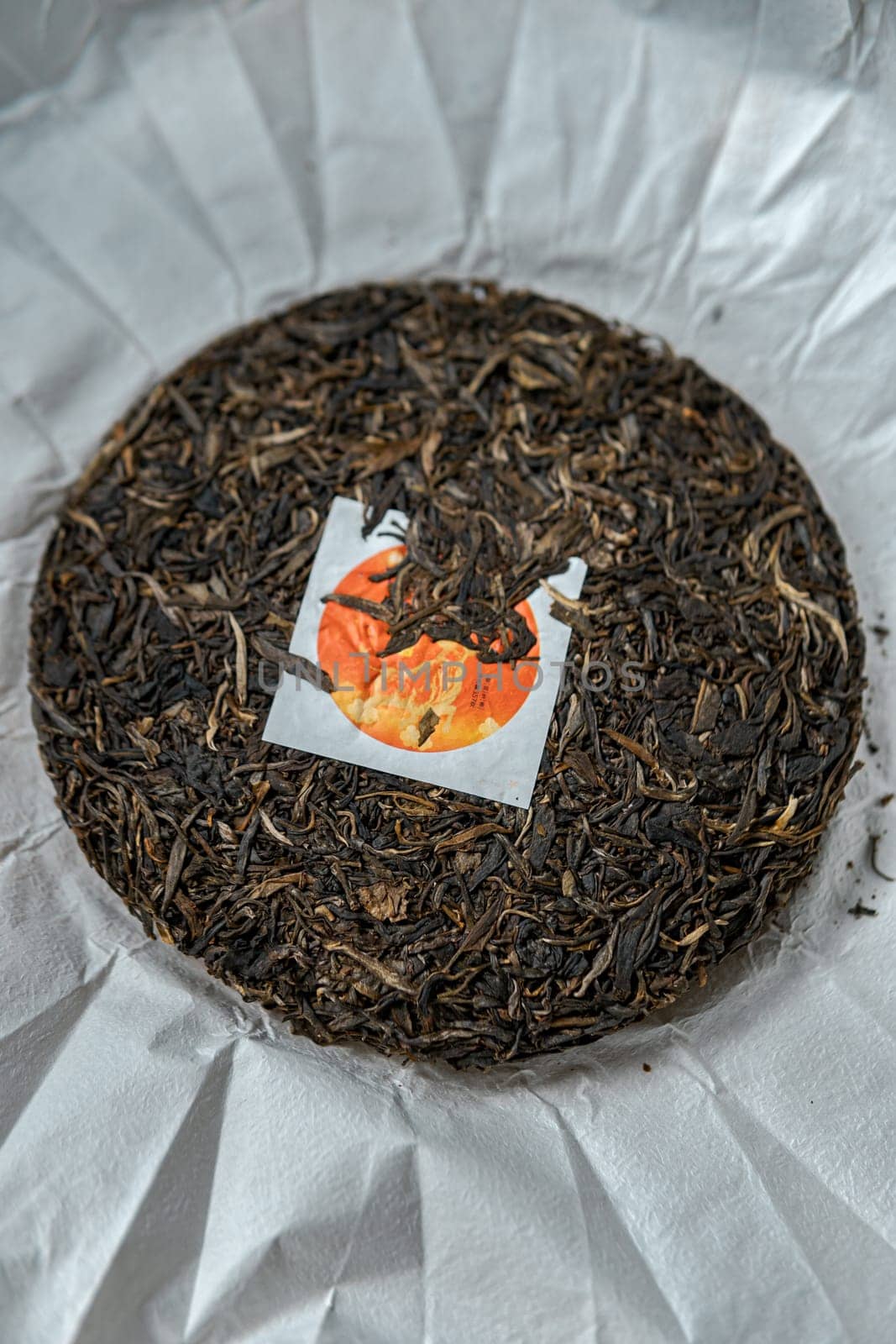 A detailed view of a beautifully crafted tea cake showcasing its unique blend and innovative packaging design