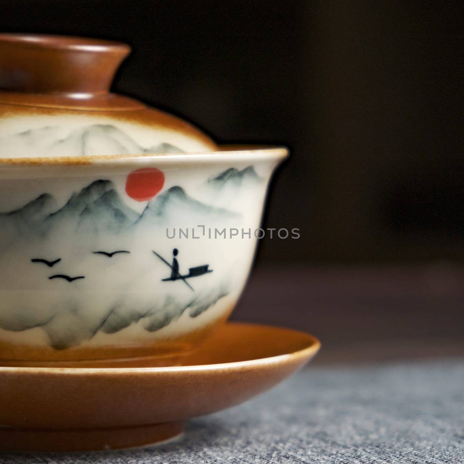 This is a beautifully designed teacup that showcases an exquisite and artistic mountain landscape scene