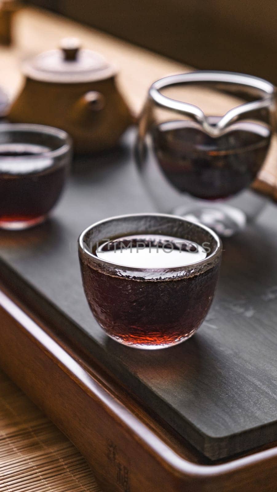 A serene tea setup with exquisite glass teacups and an elegant teapot, perfect for relaxation moments